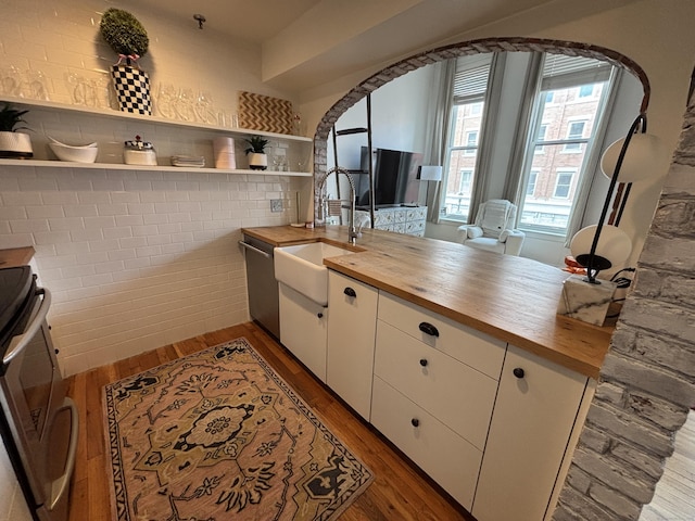 134 Washington St Apt 201, Norwalk, CT 06854 - kitchen featuring butcher block countertops, a sink, appliances with stainless steel finishes, and open shelves