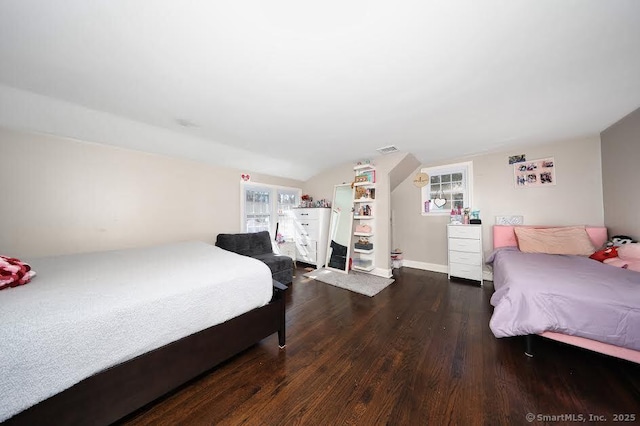 bedroom with wood finished floors and visible vents