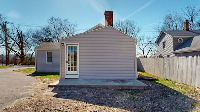 view of outbuilding with an outbuilding and fence