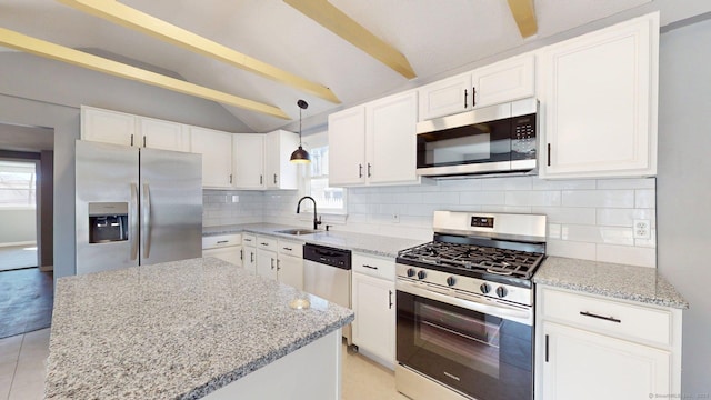 kitchen with light stone counters, stainless steel appliances, a sink, lofted ceiling with beams, and tasteful backsplash