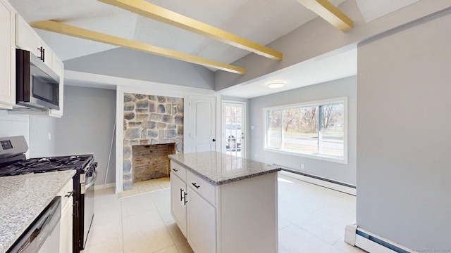 kitchen featuring stainless steel appliances, a center island, vaulted ceiling with beams, light stone countertops, and a baseboard radiator