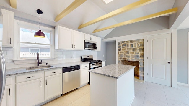 kitchen featuring decorative backsplash, stainless steel appliances, a sink, and light tile patterned floors