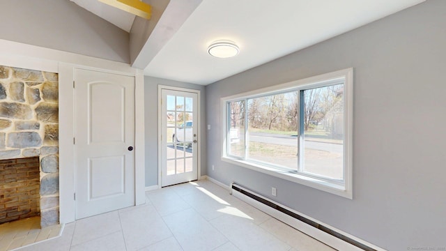 doorway to outside with baseboard heating, baseboards, and light tile patterned floors