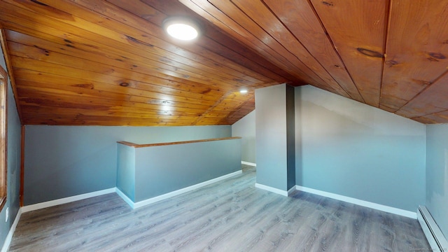 bonus room featuring wood ceiling, a baseboard radiator, lofted ceiling, and wood finished floors