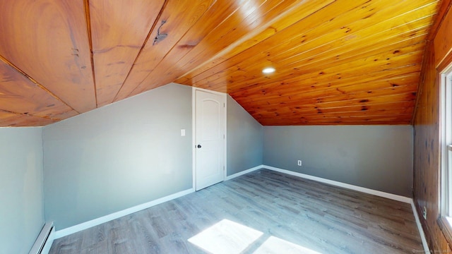 additional living space featuring a baseboard radiator, vaulted ceiling, wood finished floors, wood ceiling, and baseboards