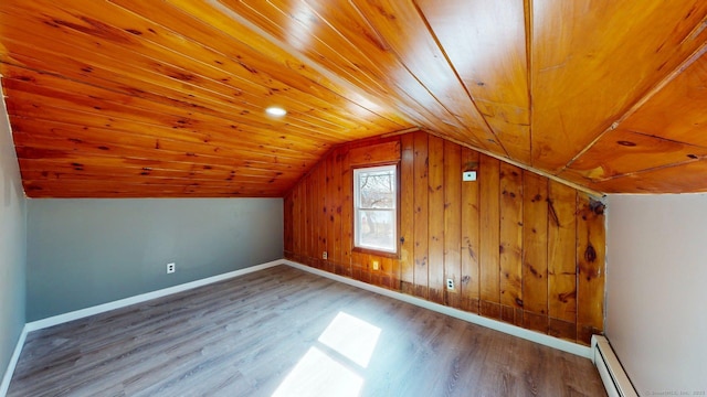bonus room featuring wooden ceiling, vaulted ceiling, wood finished floors, and baseboards