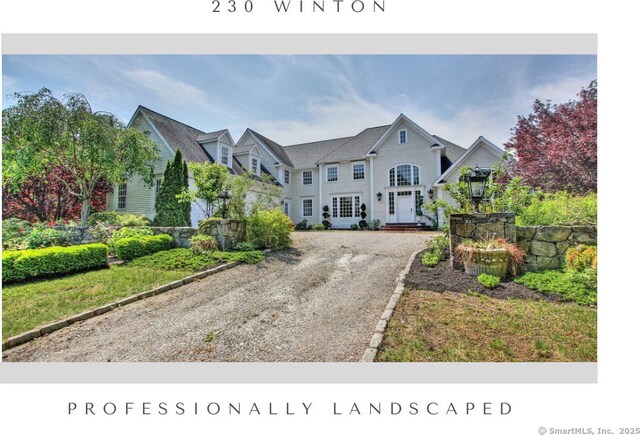 colonial-style house with driveway