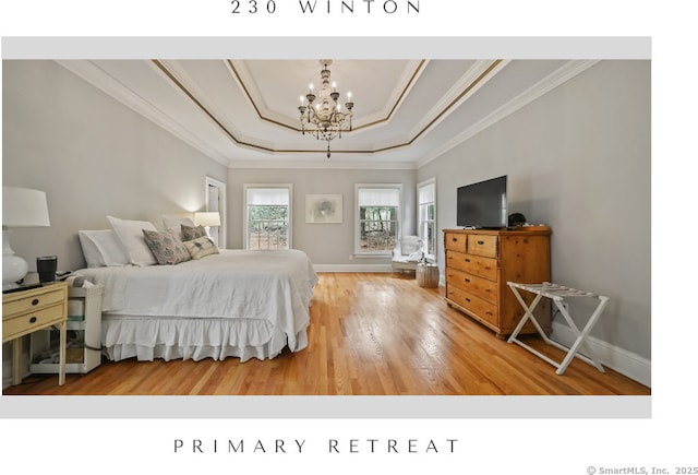 bedroom featuring a tray ceiling, wood finished floors, crown molding, baseboards, and a notable chandelier
