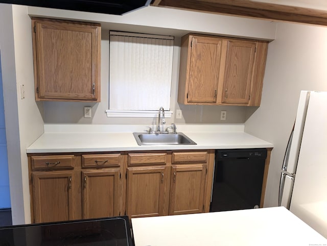 839 Main St Apt 28, Torrington, CT 06790 - kitchen with black dishwasher, a sink, light countertops, and freestanding refrigerator