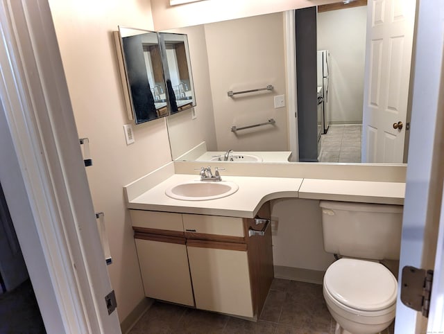 839 Main St Apt 28, Torrington, CT 06790 - bathroom featuring vanity, toilet, tile patterned floors, and baseboards