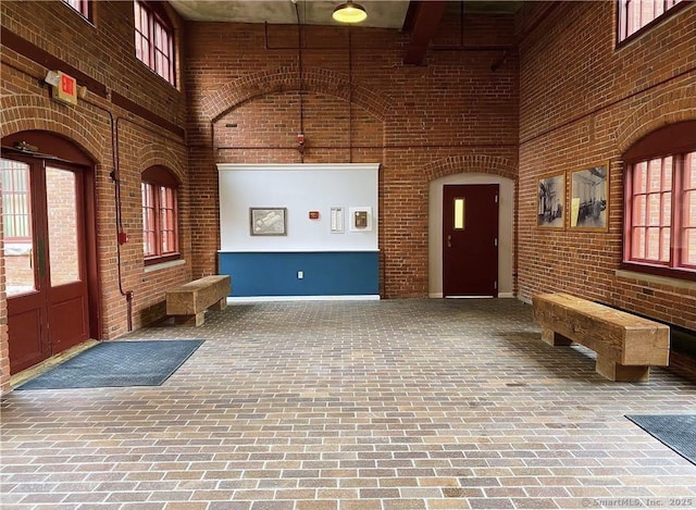 839 Main St Apt 28, Torrington, CT 06790 - reception area with a high ceiling and brick wall
