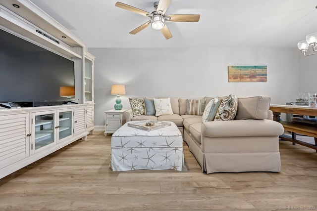 76 Carriage Path S Unit 76, Milford, CT 06460 - living room with ceiling fan with notable chandelier and wood finished floors