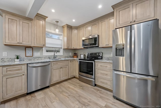76 Carriage Path S Unit 76, Milford, CT 06460 - kitchen featuring a sink, stainless steel appliances, and light brown cabinetry