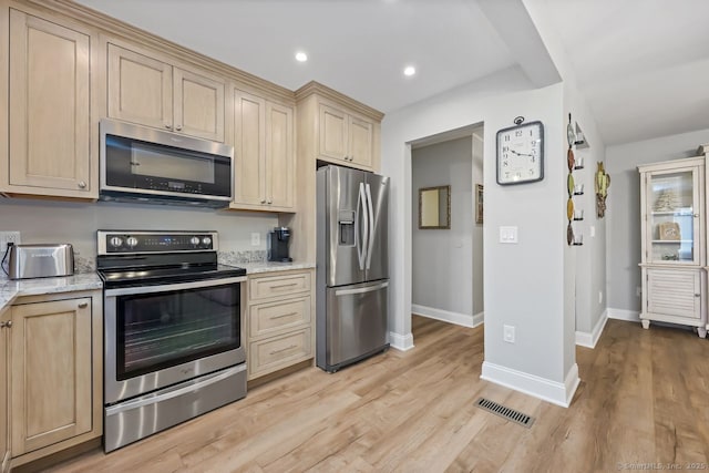 76 Carriage Path S Unit 76, Milford, CT 06460 - kitchen with light stone countertops, light wood-type flooring, stainless steel appliances, baseboards, and recessed lighting