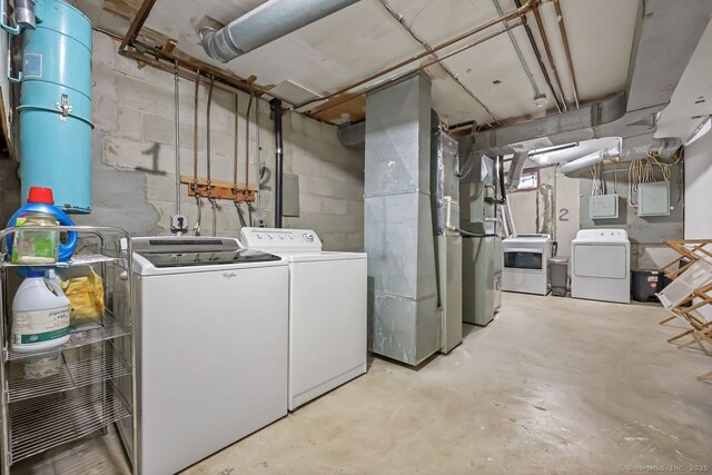 76 Carriage Path S Unit 76, Milford, CT 06460 - laundry room with concrete block wall, independent washer and dryer, laundry area, and electric panel