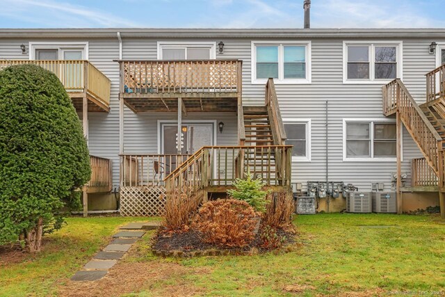 76 Carriage Path S Unit 76, Milford, CT 06460 - rear view of property with a lawn, stairs, central AC unit, and a deck