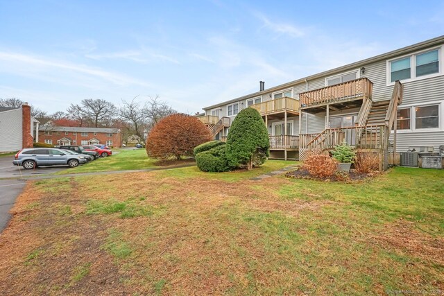 76 Carriage Path S Unit 76, Milford, CT 06460 - view of yard featuring a wooden deck and stairway