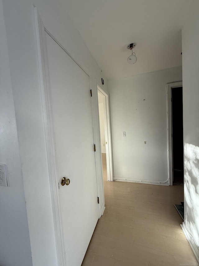 hallway with light wood-type flooring