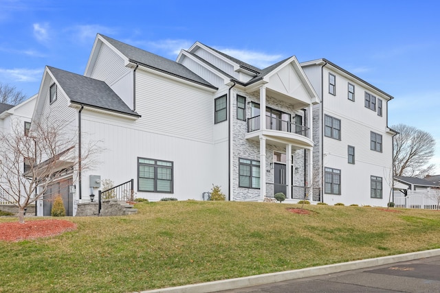 9 Little Pond Rd, Milford, CT 06460 - exterior space with a balcony, stone siding, and a front lawn