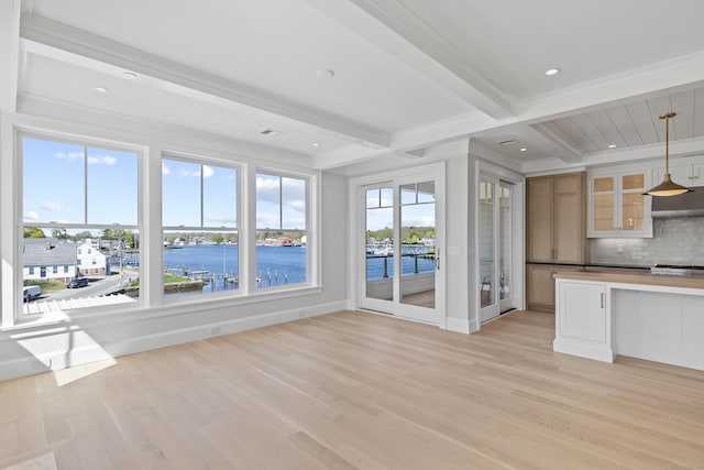 22 W Main St Unit 3, Groton, CT 06355 - interior space with decorative backsplash, beamed ceiling, baseboards, a water view, and light wood-style flooring
