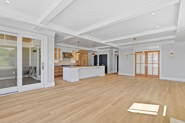 22 W Main St Unit 3, Groton, CT 06355 - unfurnished living room with beam ceiling, light wood-type flooring, an inviting chandelier, crown molding, and baseboards