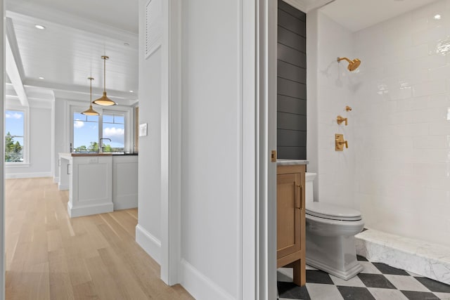22 W Main St Unit 3, Groton, CT 06355 - bathroom with vanity, wood finished floors, a tile shower, and toilet