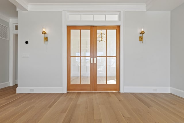 22 W Main St Unit 3, Groton, CT 06355 - entryway with baseboards, ornamental molding, and light wood finished floors