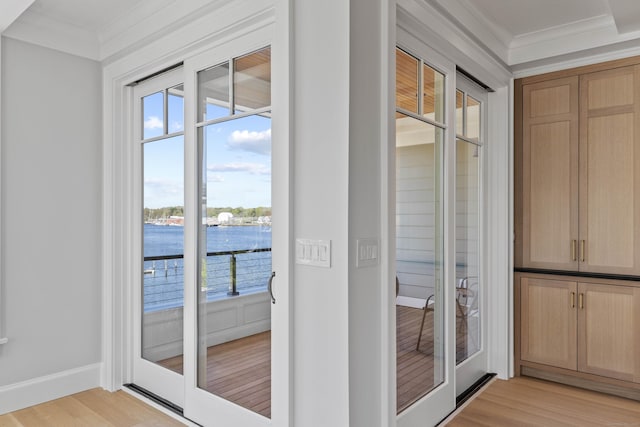 22 W Main St Unit 3, Groton, CT 06355 - doorway featuring light wood-style floors, baseboards, and ornamental molding