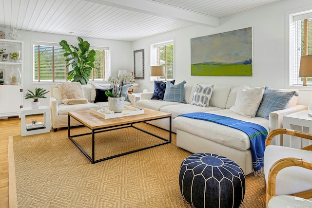 living room featuring beam ceiling, wood finished floors, and baseboard heating
