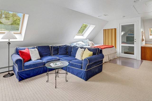 carpeted living area featuring a baseboard heating unit, attic access, and vaulted ceiling with skylight