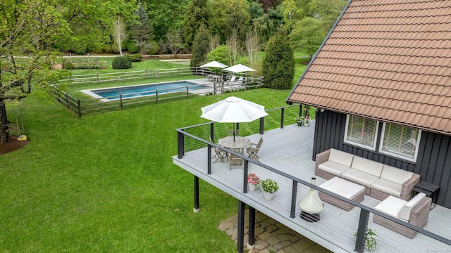 exterior space with a yard, fence, a fenced in pool, and an outdoor living space