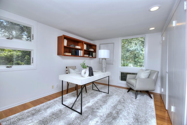 office with wood finished floors, baseboards, and recessed lighting