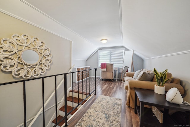 additional living space featuring vaulted ceiling and wood finished floors