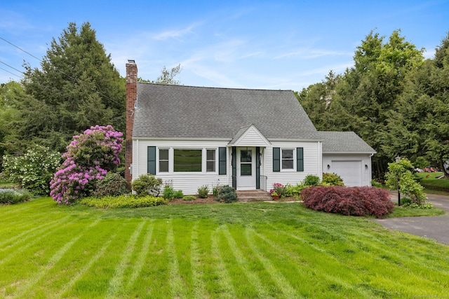 81 Beelzebub Rd, South Windsor, CT 06074 - new england style home with an attached garage, a front lawn, a chimney, and roof with shingles