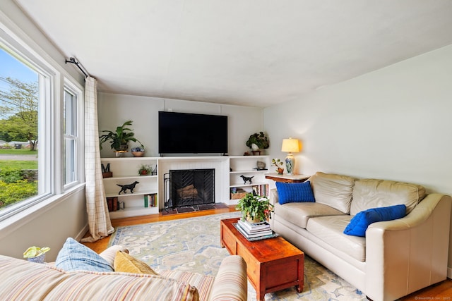 81 Beelzebub Rd, South Windsor, CT 06074 - living area featuring wood finished floors and a fireplace
