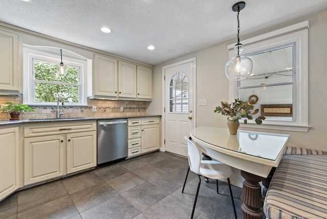 81 Beelzebub Rd, South Windsor, CT 06074 - kitchen with stainless steel dishwasher, a sink, cream cabinets, decorative backsplash, and recessed lighting