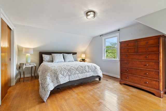 81 Beelzebub Rd, South Windsor, CT 06074 - bedroom featuring light wood-type flooring, baseboards, lofted ceiling, and a closet