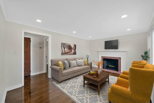 17 Lydall Rd, East Hartford, CT 06111 - living room featuring wood finished floors, a brick fireplace, baseboards, recessed lighting, and ornamental molding
