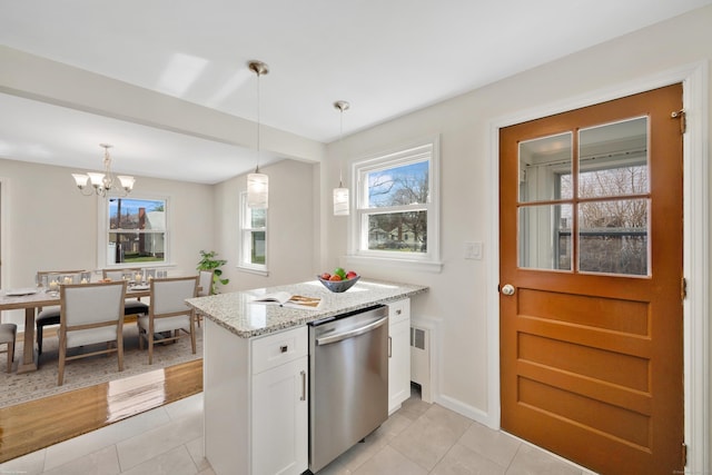 17 Lydall Rd, East Hartford, CT 06111 - kitchen with dishwasher, light stone counters, white cabinetry, light tile patterned floors, and hanging light fixtures