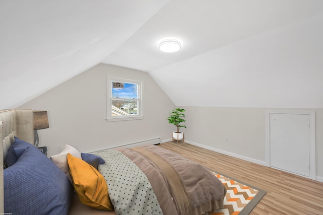17 Lydall Rd, East Hartford, CT 06111 - bedroom with wood finished floors, baseboards, baseboard heating, and vaulted ceiling