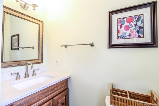 half bathroom featuring toilet and vanity