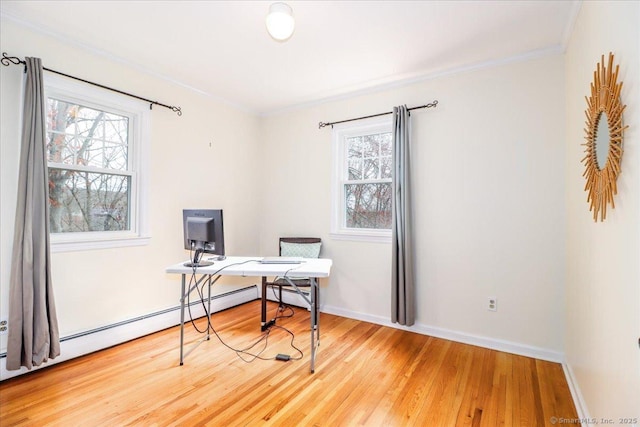 office area featuring crown molding, a wealth of natural light, and wood finished floors