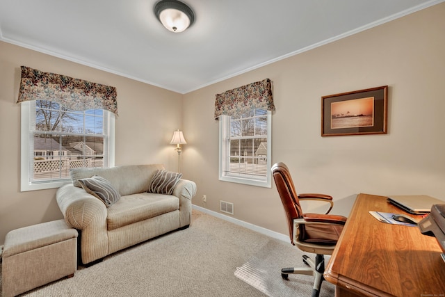 carpeted home office featuring baseboards, visible vents, and ornamental molding