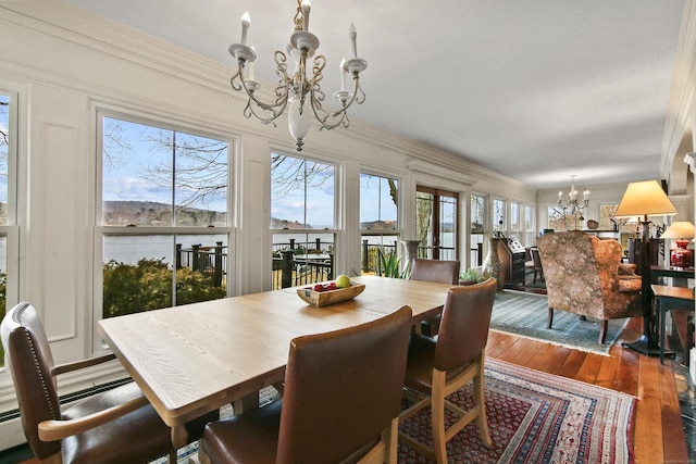 77 Main St, East Haddam, CT 06423 - dining room featuring a chandelier, hardwood / wood-style floors, and crown molding