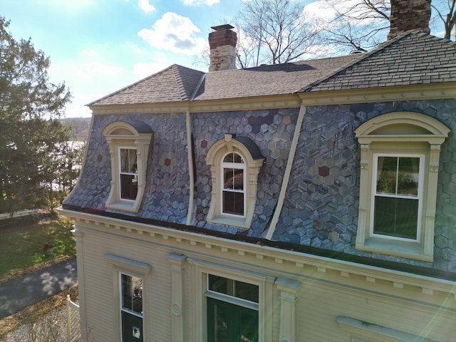 77 Main St, East Haddam, CT 06423 - view of side of home with a chimney and a high end roof