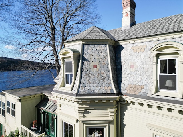 77 Main St, East Haddam, CT 06423 - view of side of property with a high end roof, a chimney, and a water view