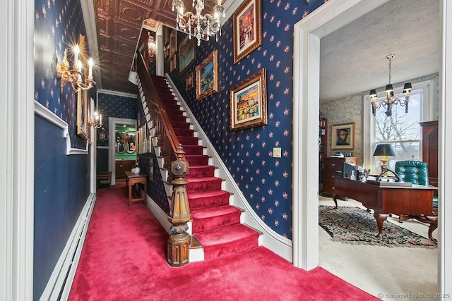 77 Main St, East Haddam, CT 06423 - stairway featuring a chandelier, baseboard heating, wallpapered walls, carpet floors, and baseboards