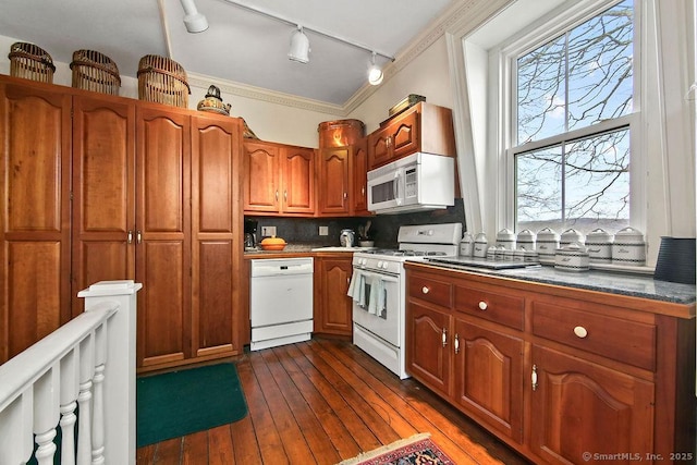 77 Main St, East Haddam, CT 06423 - kitchen with white appliances, rail lighting, healthy amount of natural light, brown cabinets, and crown molding