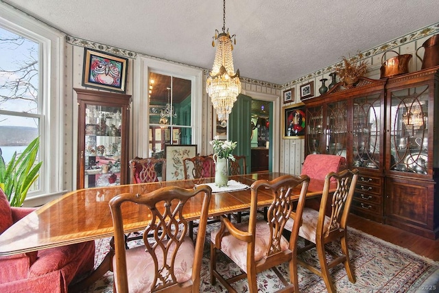 77 Main St, East Haddam, CT 06423 - dining area featuring a chandelier, a textured ceiling, and wood finished floors