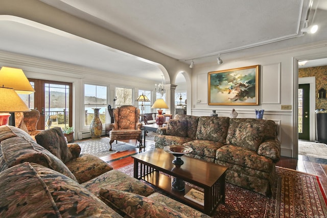 77 Main St, East Haddam, CT 06423 - living room with hardwood / wood-style flooring, arched walkways, plenty of natural light, and decorative columns